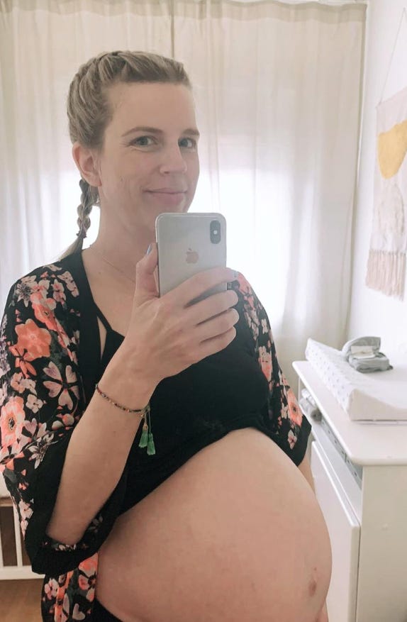 pregnant woman taking a selfie
