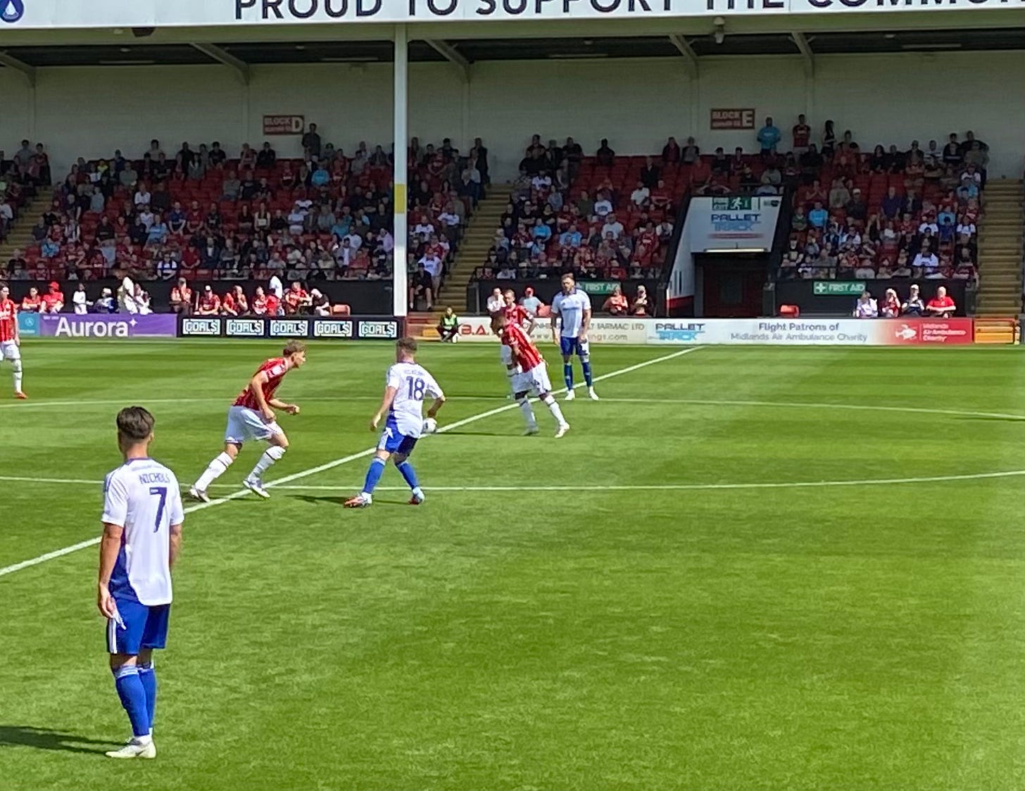 In the sunshine at the Bescot stadium, Walsall take the first kick of the season