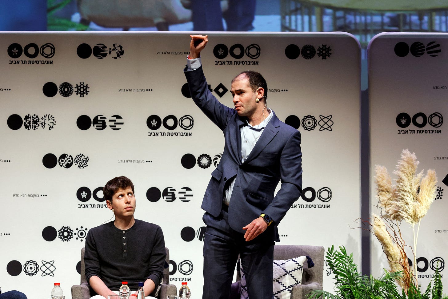 Sam Altman, CEO of OpenAI and ChatGPT creator listens to Ilya Sutskever co-founder and Chief Scientist of OpenAI in Tel Aviv