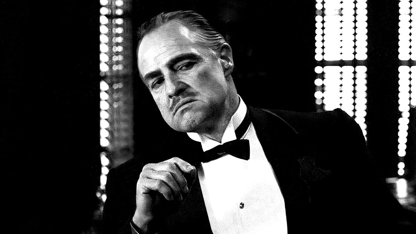 Marlon Brando as Don Vito Corleone leaning in The Godfather. Marlon Brando as Don Vito Corleone leaning in The Godfather.