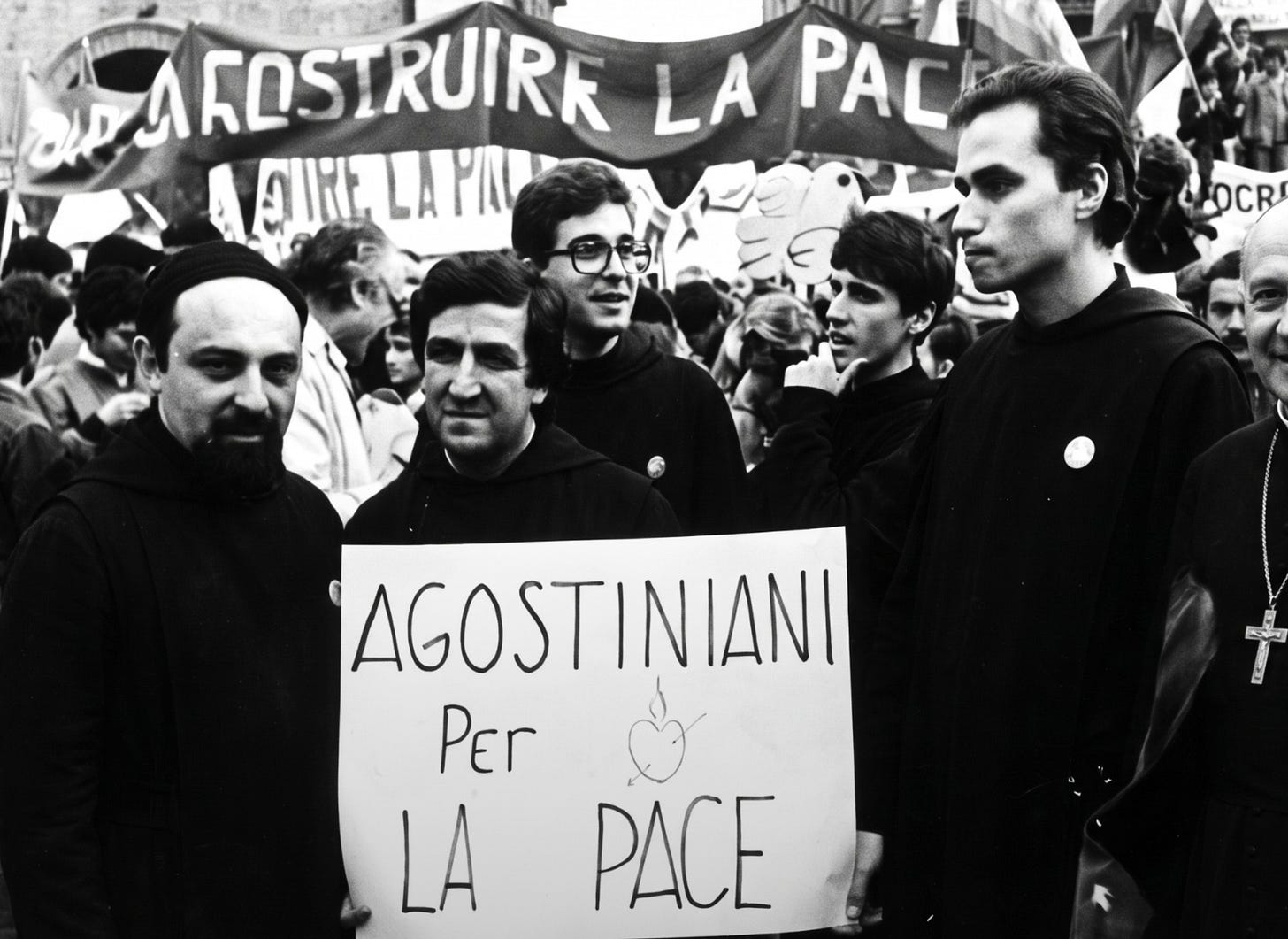 Augustinian friars marching in Rome in 1983 behind a banner reading Agostiniani per la Pace Augustinian friars marching in Rome in 1983 behind a banner reading Agostiniani per la Pace