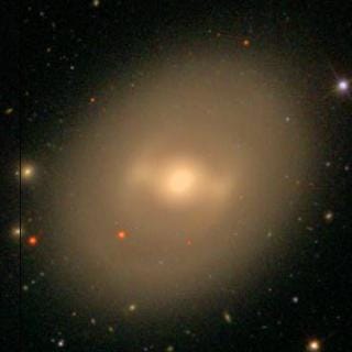 NGC 936, a red barred spiral galaxy. Credit: SDSS SkyServer