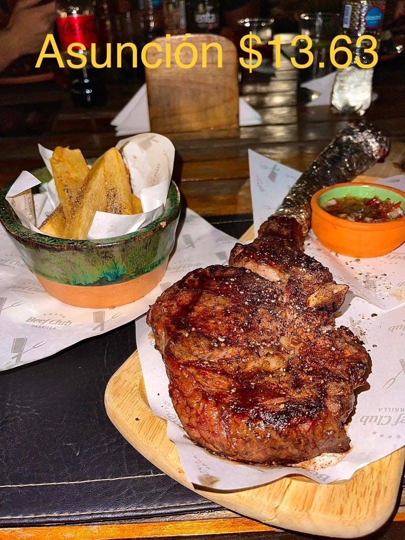 A steak and fries on a wooden board

Description automatically generated