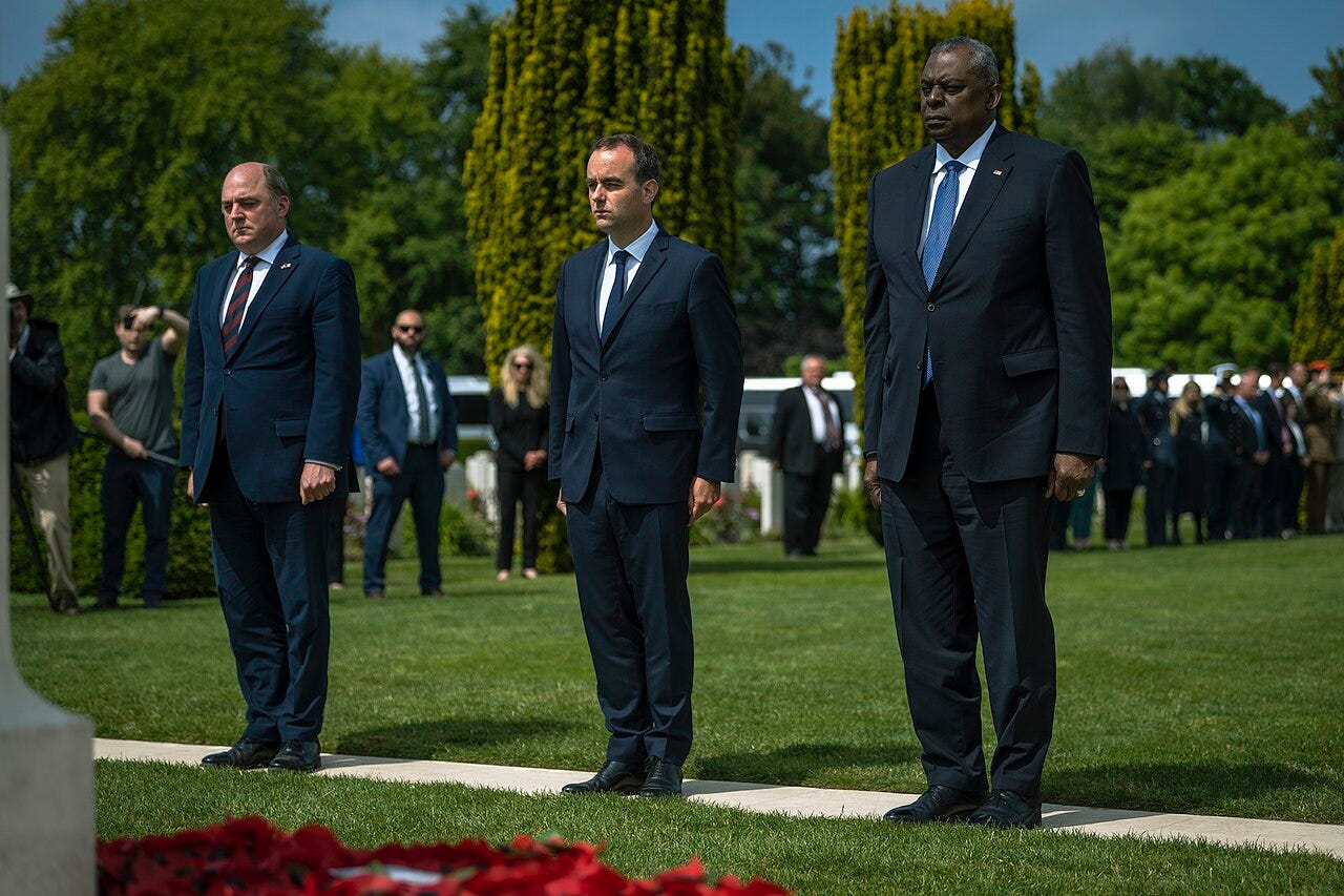 UK Secretary of State for Defence Ben Wallace, French Minister of the Armed Forces Sébastien Lecornu and Secretary of Defense Lloyd J. Austin III lay wreaths at the Bayeux War Cemetery, Bayeux France commemorating the 79th anniversary of Operation Overlord and the invasion of Normandy during World War II, June 6, 2023. (DoD photo by Chad J. McNeeley) UK Secretary of State for Defence Ben Wallace, French Minister of the Armed Forces Sébastien Lecornu and Secretary of Defense Lloyd J. Austin III lay wreaths at the Bayeux War Cemetery, Bayeux France commemorating the 79th anniversary of Operation Overlord and the invasion of Normandy during World War II, June 6, 2023. (DoD photo by Chad J. McNeeley)