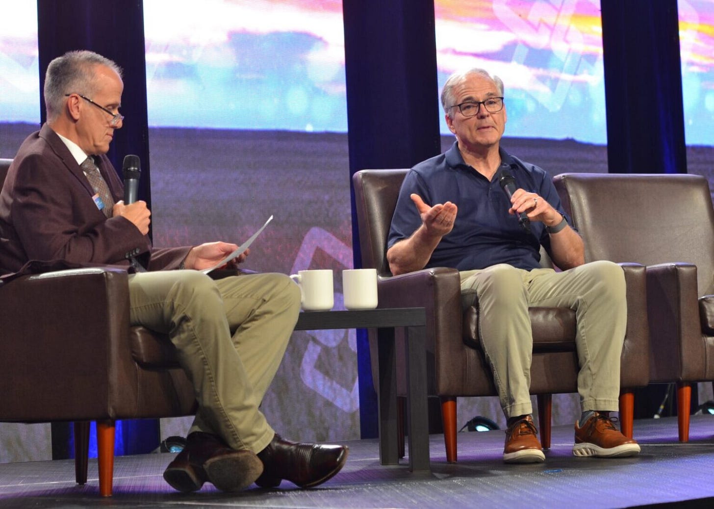 Chris Ryan, right, president and chief operating officer of renewable fuels company Gevo, speaks June 10, 2025, in West Fargo, N.D., at the Midwest Ag Summit. At left is Greg Lardy, vice president for agriculture at North Dakota State University. (Jeff Beach/North Dakota Monitor)