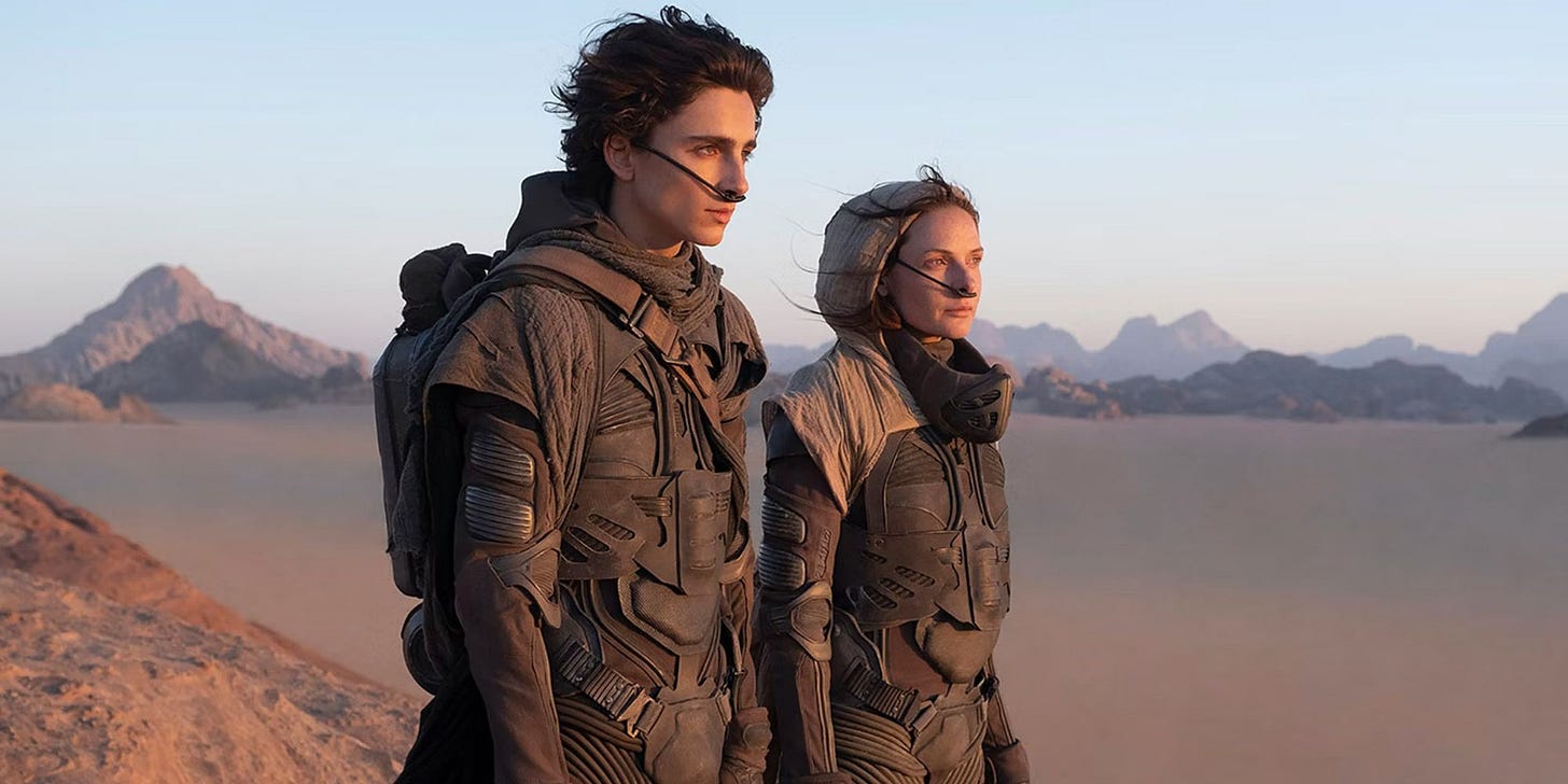 Paul (Timothee Chalamet) and Jessica (Rebecca Ferguson) in the Arrakis desert in Dune (2021) Paul (Timothee Chalamet) and Jessica (Rebecca Ferguson) in the Arrakis desert in Dune (2021)