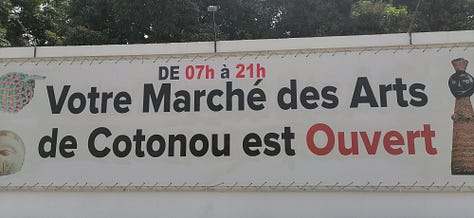 Pictures of the artwork on sale at the Marche des Arts de Cotonou, the Amazone statue, the Benin Congress building, and the second largest graffiti wall in the world