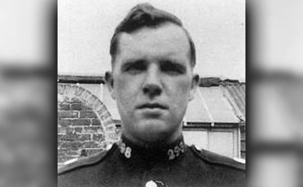 Head and shoulders shots of two officers, one wearing a suit and the other in full police uniform.