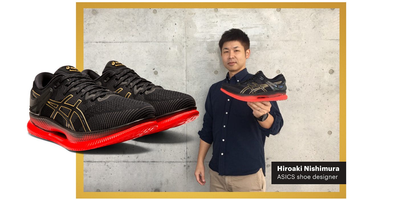 ASICS shoe designer holding the Metaride shoe. ASICS shoe designer holding the Metaride shoe.