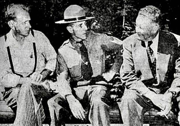 A group of men sitting on a bench

AI-generated content may be incorrect.