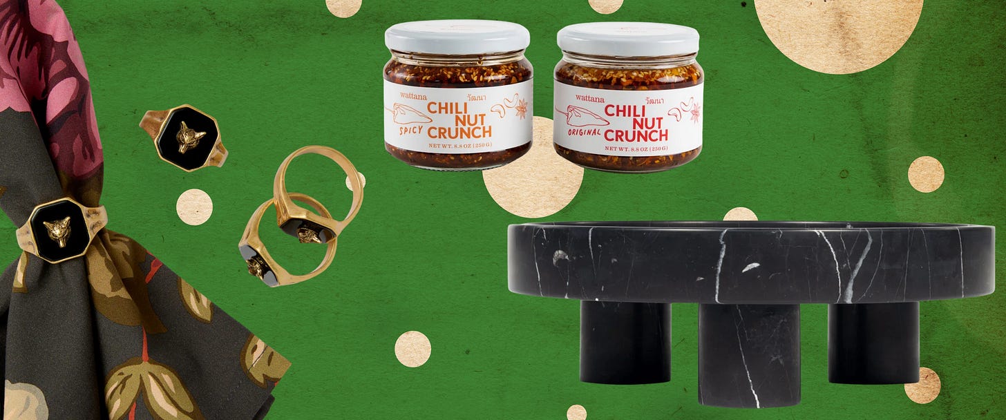 signet napkin rings, chili nut crunch, and a black marble cake stand.