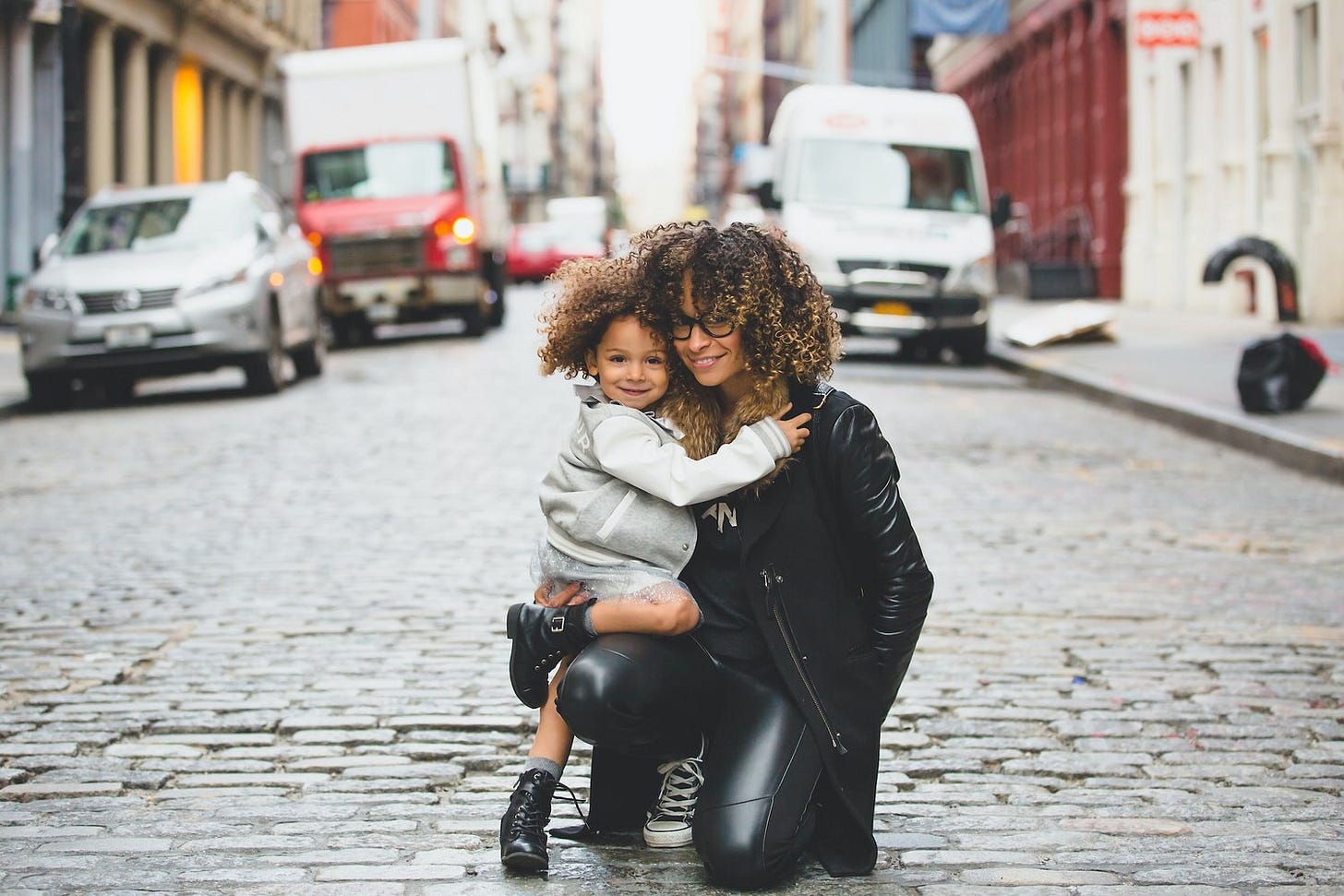 woman with child on city street