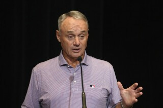 MLB Commissioner Rob Manfred speaks during a news conference Tuesday, Feb. 18, 2025, in Phoenix. (AP Photo/Ross D. Franklin)