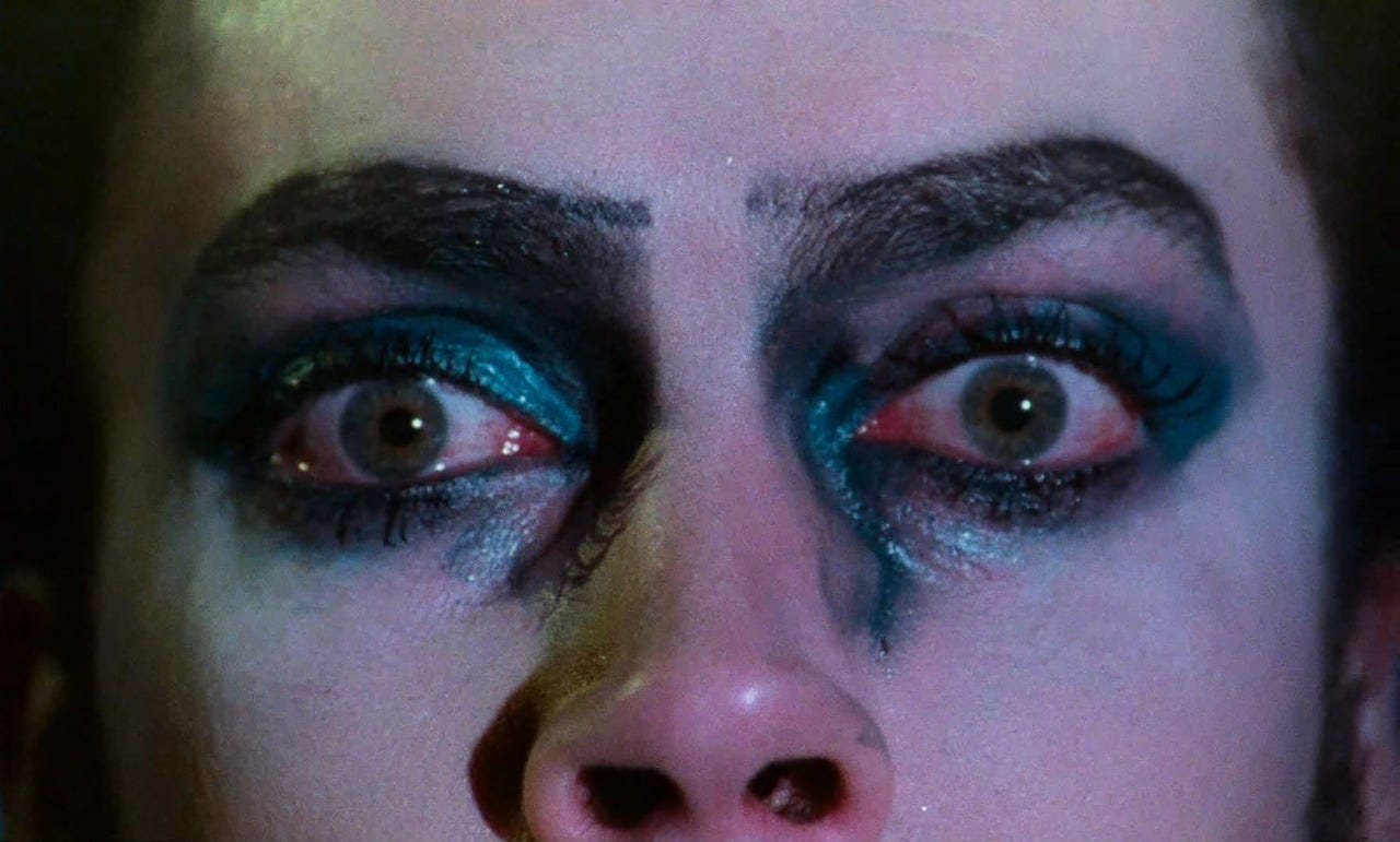 A close-up on the face of Dr. Frank N' Furter, blue eyeshadow smeared with water and tears, in "The Rocky Horror Picture Show" (1975) A close-up on the face of Dr. Frank N' Furter, blue eyeshadow smeared with water and tears, in "The Rocky Horror Picture Show" (1975)