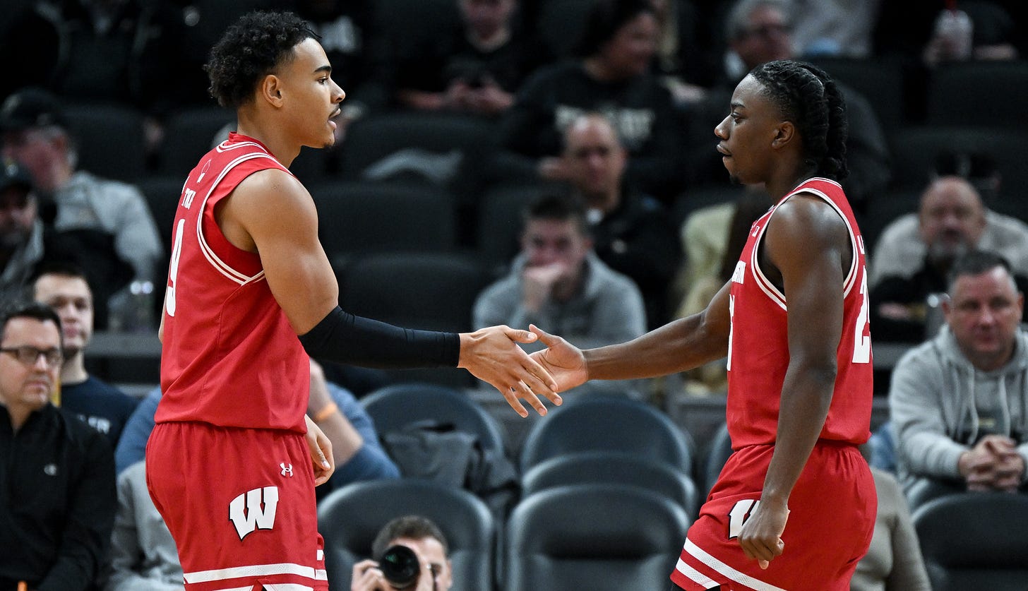 Wisconsin Badgers guard John Tonje (9) and guard John Blackwell (25) celebrate after a play 