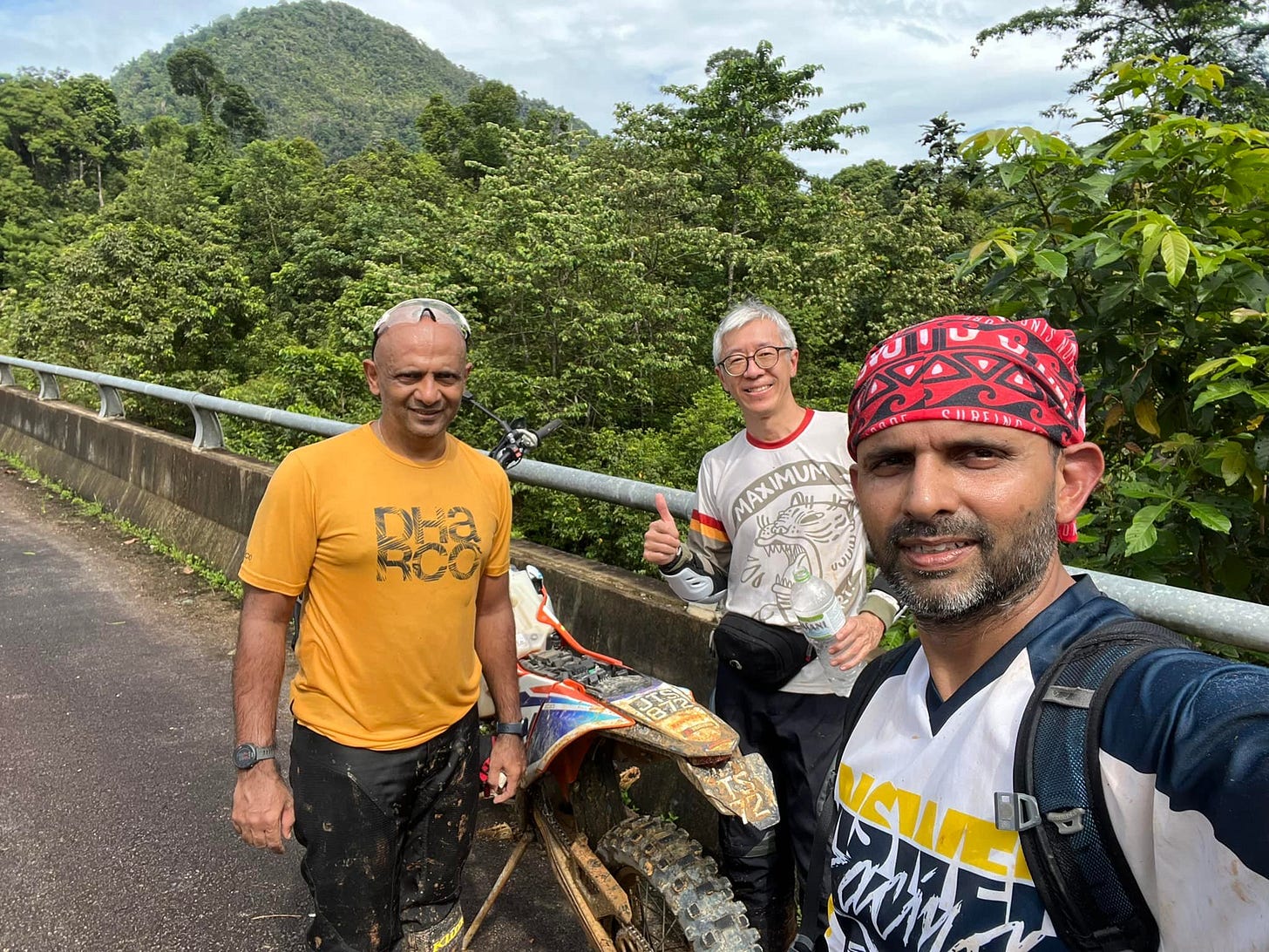 May be an image of 3 people, people standing and mountain