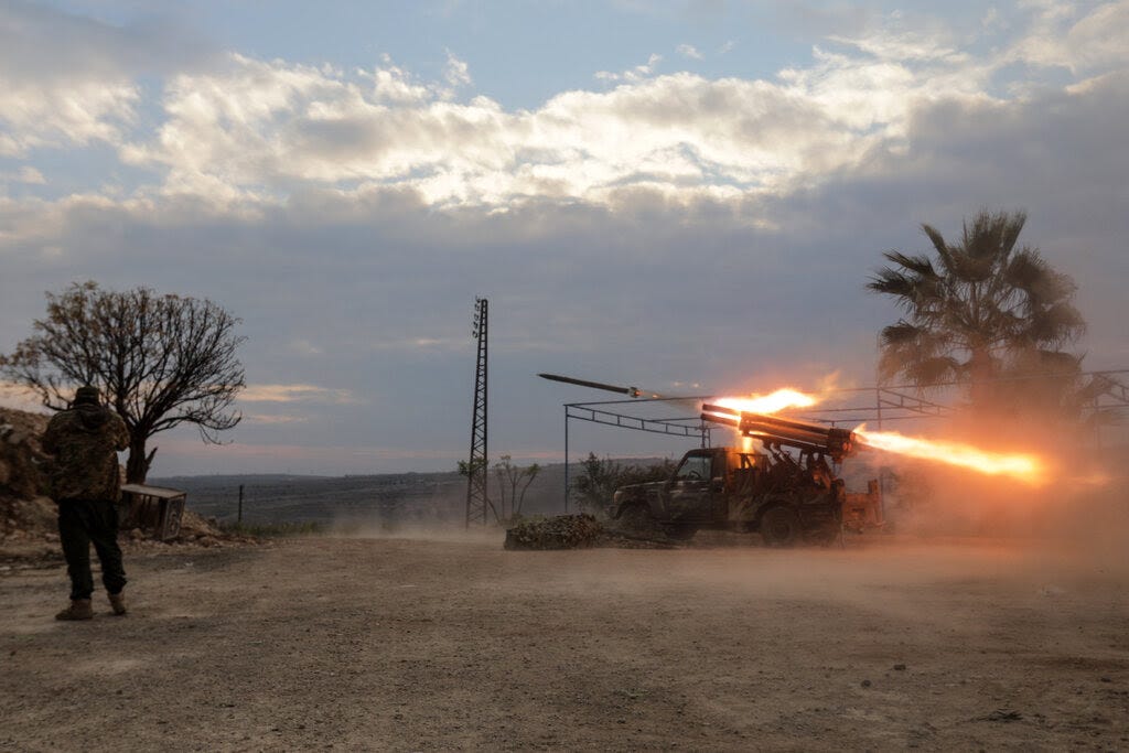 A rocket launcher mounted on a truck fires.
