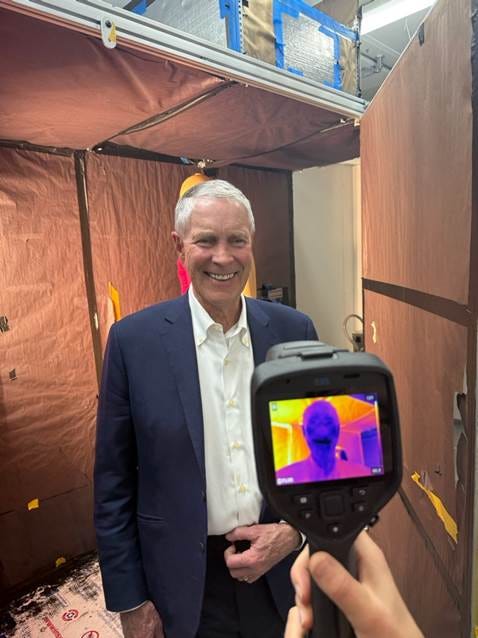 A person holding a camera

AI-generated content may be incorrect.
