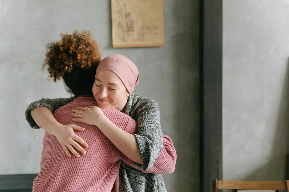 Two women hugging Two women hugging