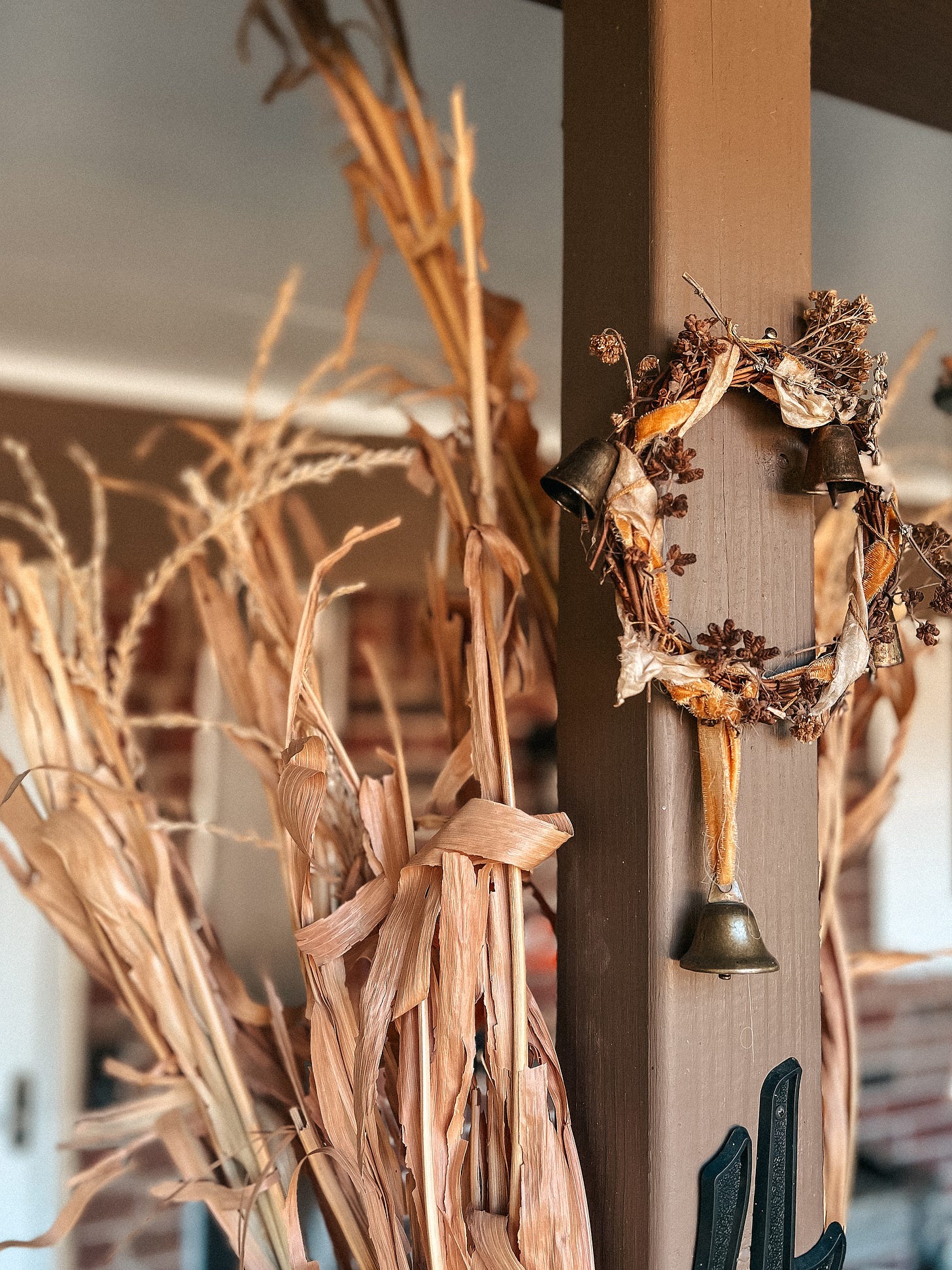 Witch bells hang outside a house's front door.