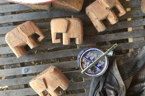LAOS: Wooden carving village LAOS: Wooden carving village