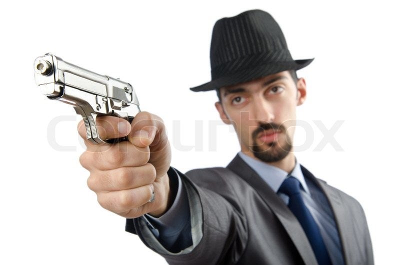 Man with gun isolated on white | Stock image | Colourbox