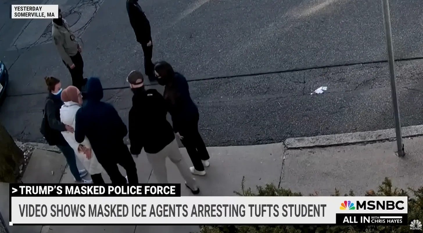 screenshot of MSNBC's March report on the arrest of Rümeysa Öztürk, showing masked ICE agents surrounding her as she stands with her hands cuffed behind her back. Chyron reads 'Video shows masked ICE agents arresting Tufts student' 
