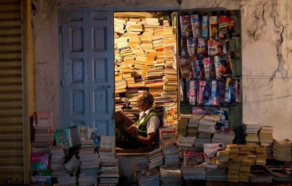 Bookseller in Rabat, Morocco, reading in his shop that he's owned since  1967. [OC] [4272 x 2848] : r/HumanPorn