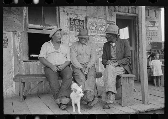Negroes talking on porch of small store near Jeanerette, Louisiana Negroes talking on porch of small store near Jeanerette, Louisiana
