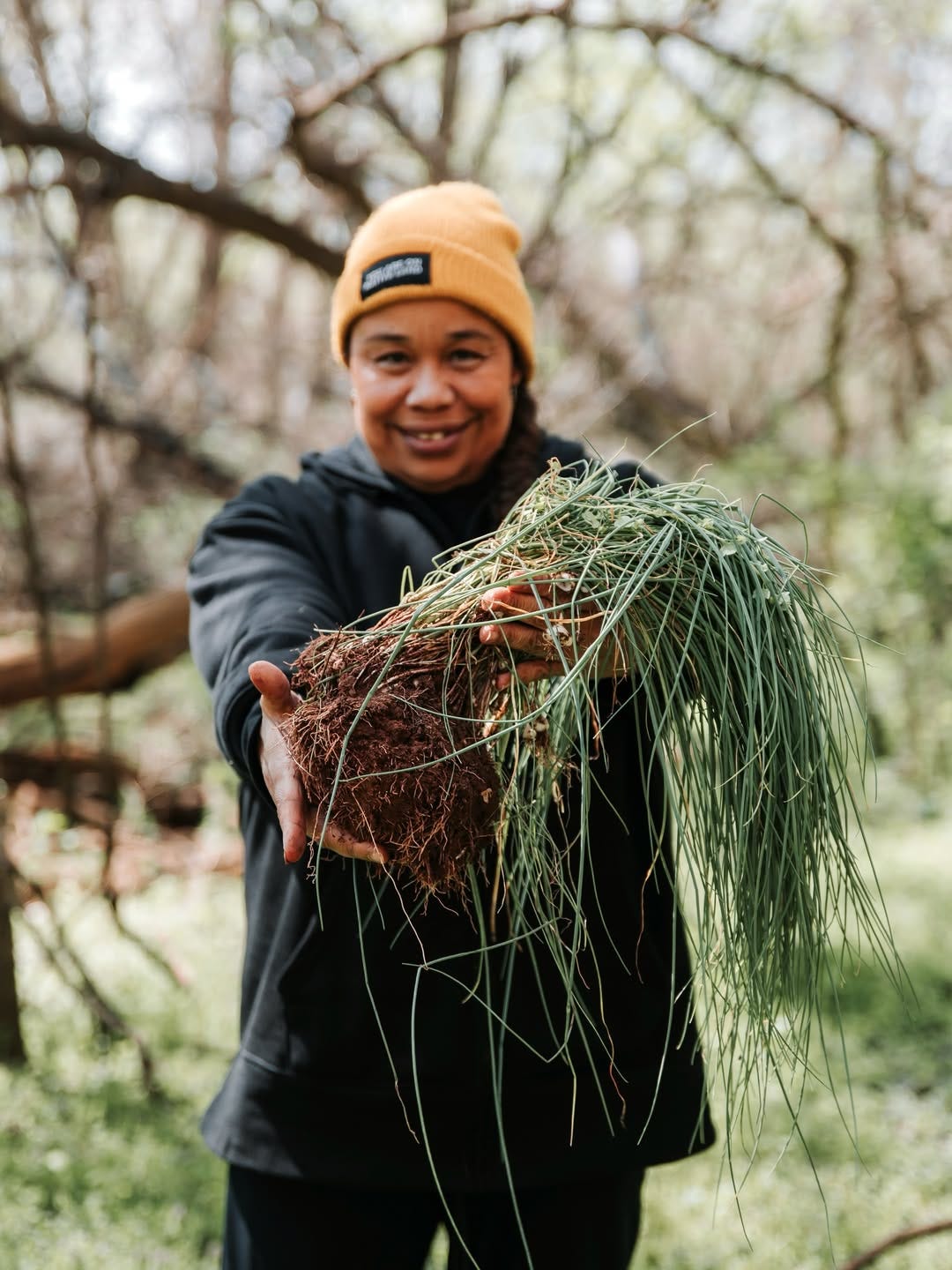 Chef Crystal Wahpepah harvesting food from the land
