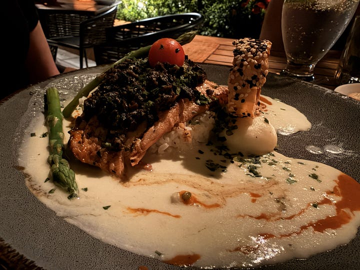 Coconut soup, salmon tiradito, white fish topped with escargots, octopus in ginger butter