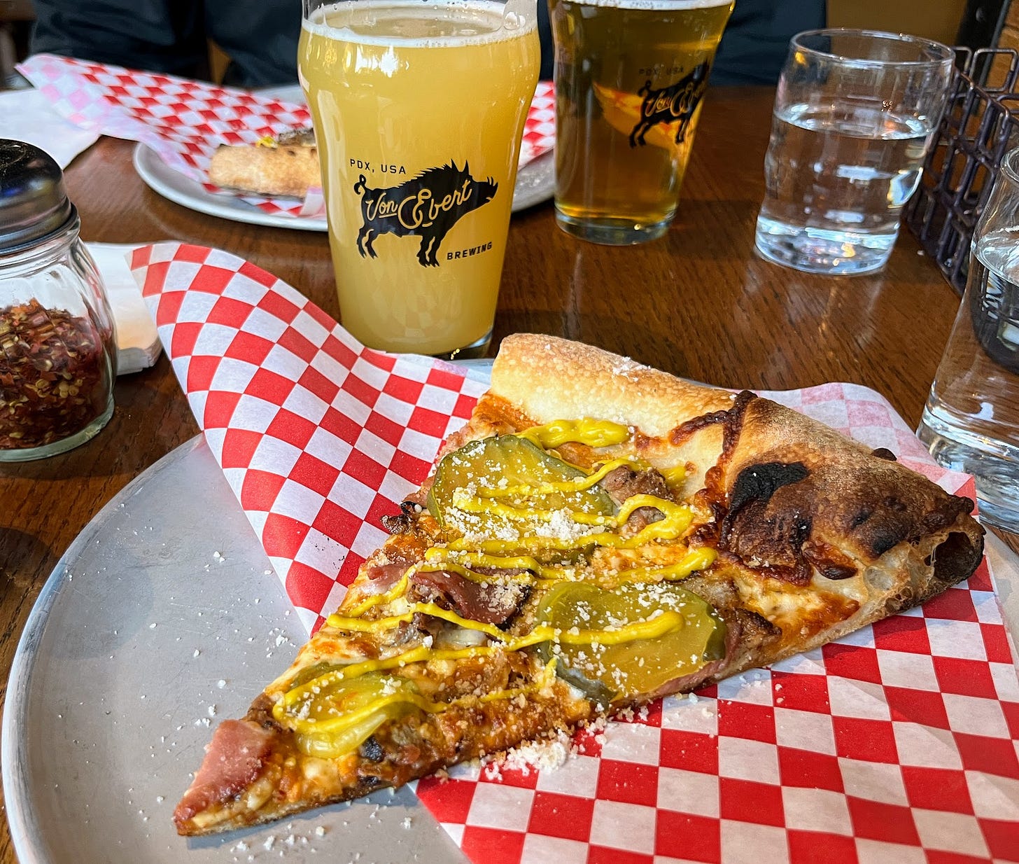 Slice of Cubano Pie pizza on a plate