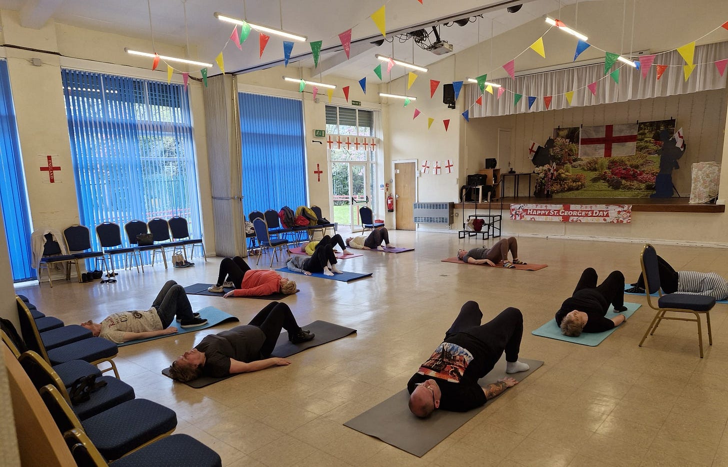 Image showing a back care class with class members doing a mat-based exercise.