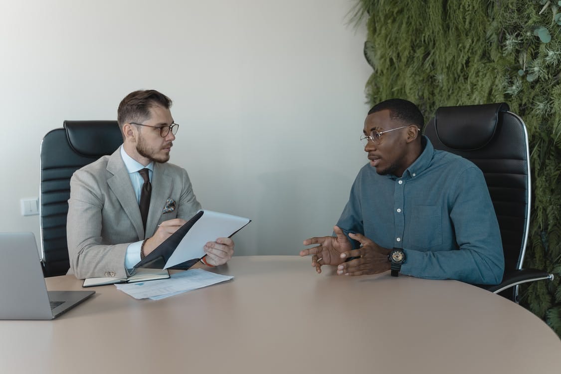 Free Man in Blue Dress Shirt Talking Stock Photo