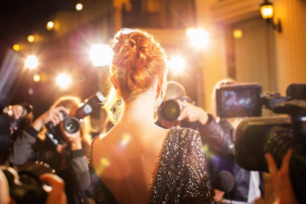 Celebrity being photographed by paparazzi photographers at event superstar glamour stock pictures, royalty-free photos & images Celebrity being photographed by paparazzi photographers at event superstar glamour stock pictures, royalty-free photos & images