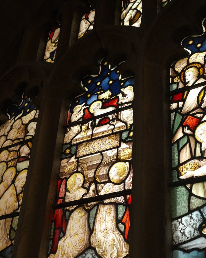 Church flowers and stained glass windows. Praising Shadows / Rebecka Wolfe
