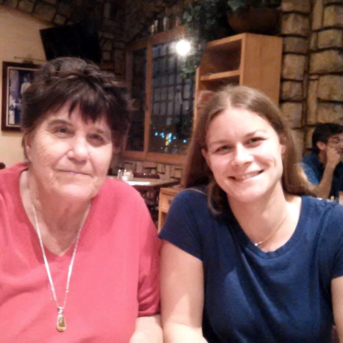 Mom and me sitting in a restaurant