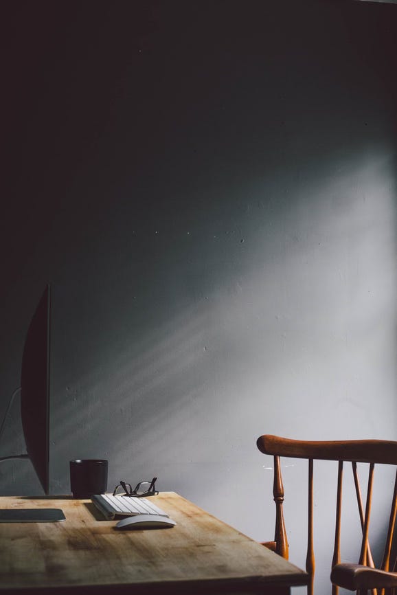 a desktop computer on a wooden table