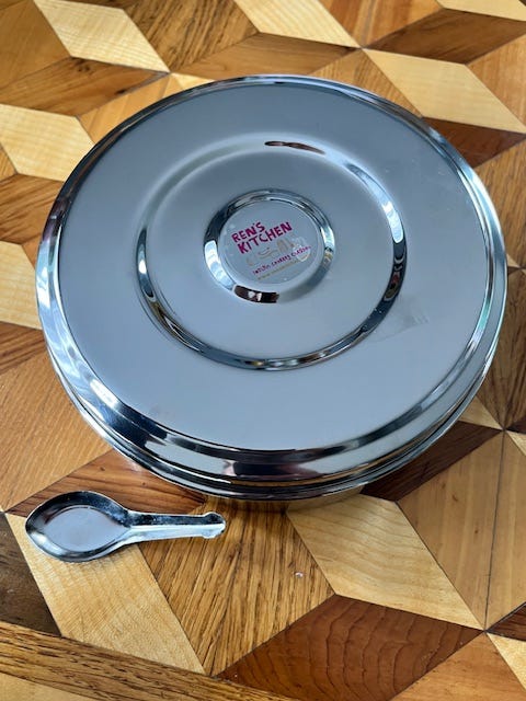 Four images of a stainless steel masala tin with seven spices suitable for Indian dishes and curries.