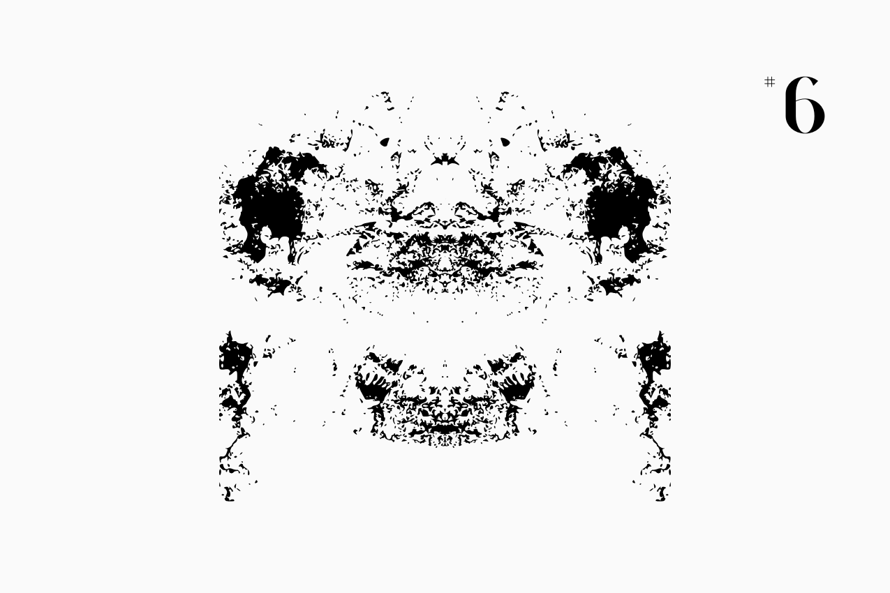 A bilateral, Rorschach-style inkblot specimen for the “In Other Words” series from The Subtext Review. The charcoal-black symmetrical splatter is centered on a cream paper background, labeled as Puzzle No. 6 in a classic serif typeface.
