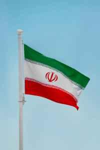 iran national flag under blue sky iran national flag under blue sky