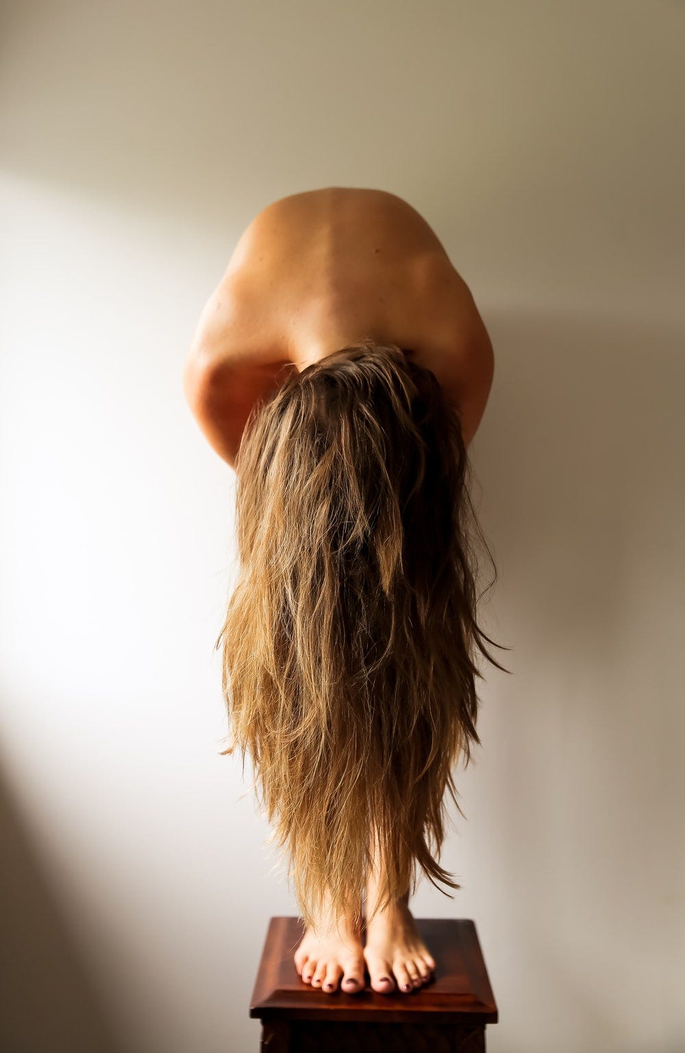 woman standing near white wall