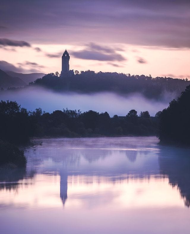 May be an image of castle, nature, twilight, fog, lake and bell tower May be an image of castle, nature, twilight, fog, lake and bell tower