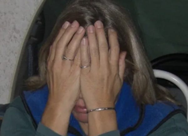 woman holding her hands over her eyes for palming effect