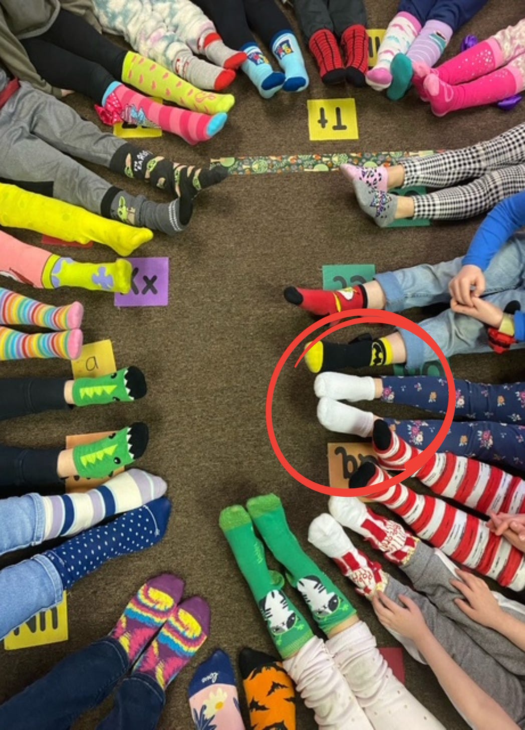 Child wearing plain white socks on school picture day, missing the themed Crazy Sock Day dress code. Child wearing plain white socks on school picture day, missing the themed Crazy Sock Day dress code.