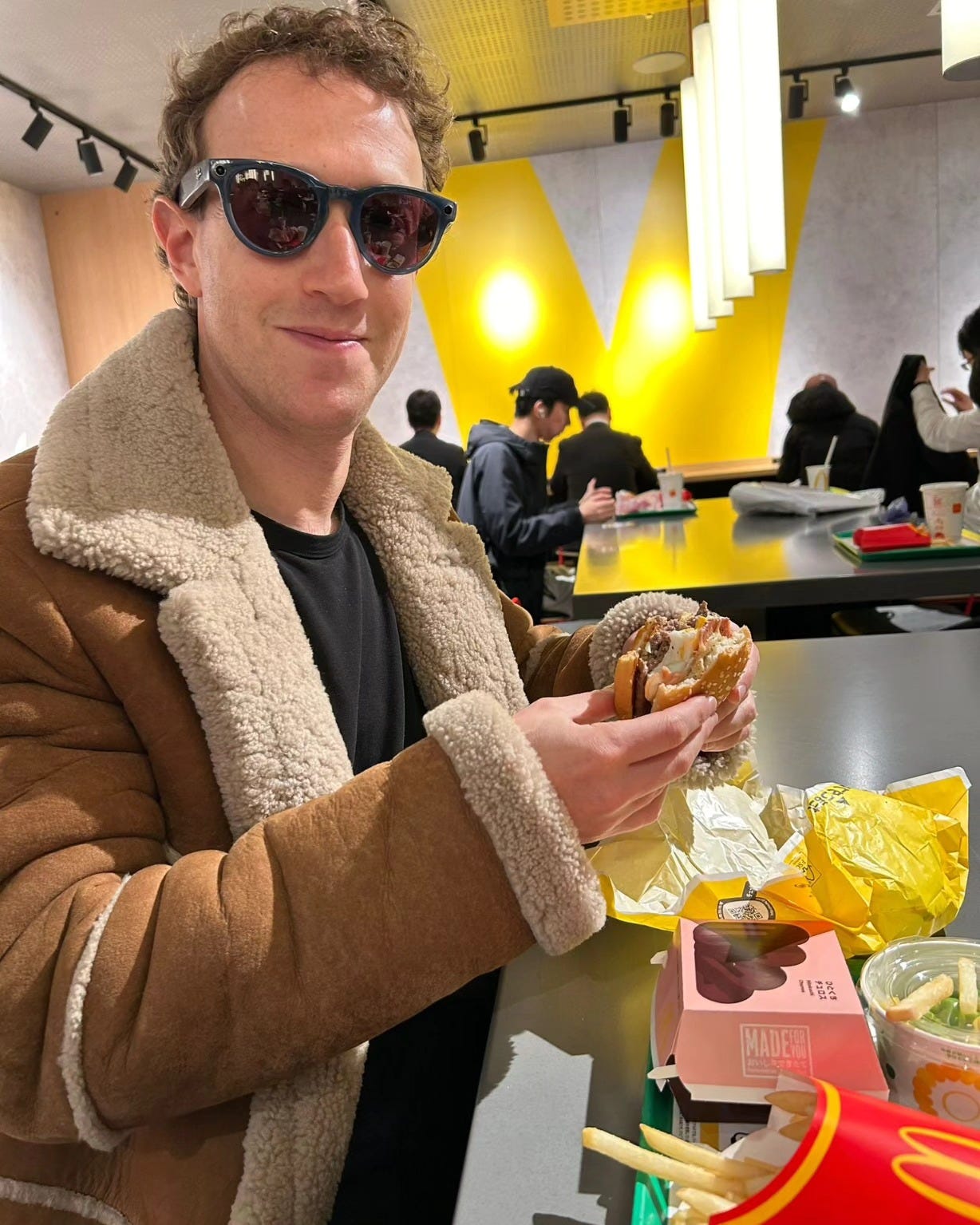 May be an image of 3 people, eyewear and burger