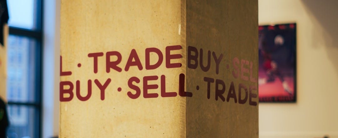 A sign that says i trade buy sell trade - Photo by Jake Banasik on Unsplash A sign that says i trade buy sell trade - Photo by Jake Banasik on Unsplash