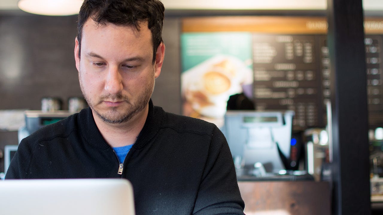 Jason Harris at his neighborhood Peet's, working on his podcast "Jew Oughta Know" (Photo/David Mamaril Horowitz)