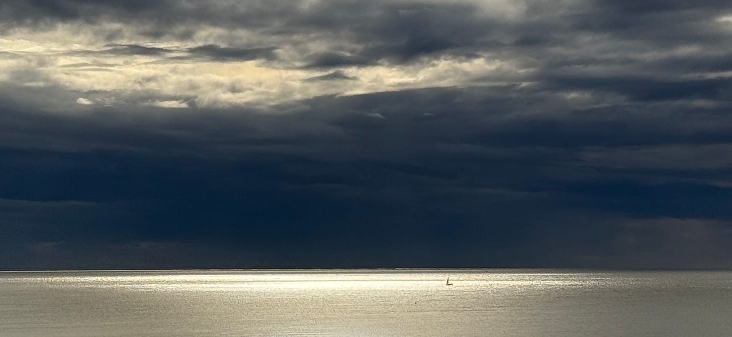 silver water with a black sky above