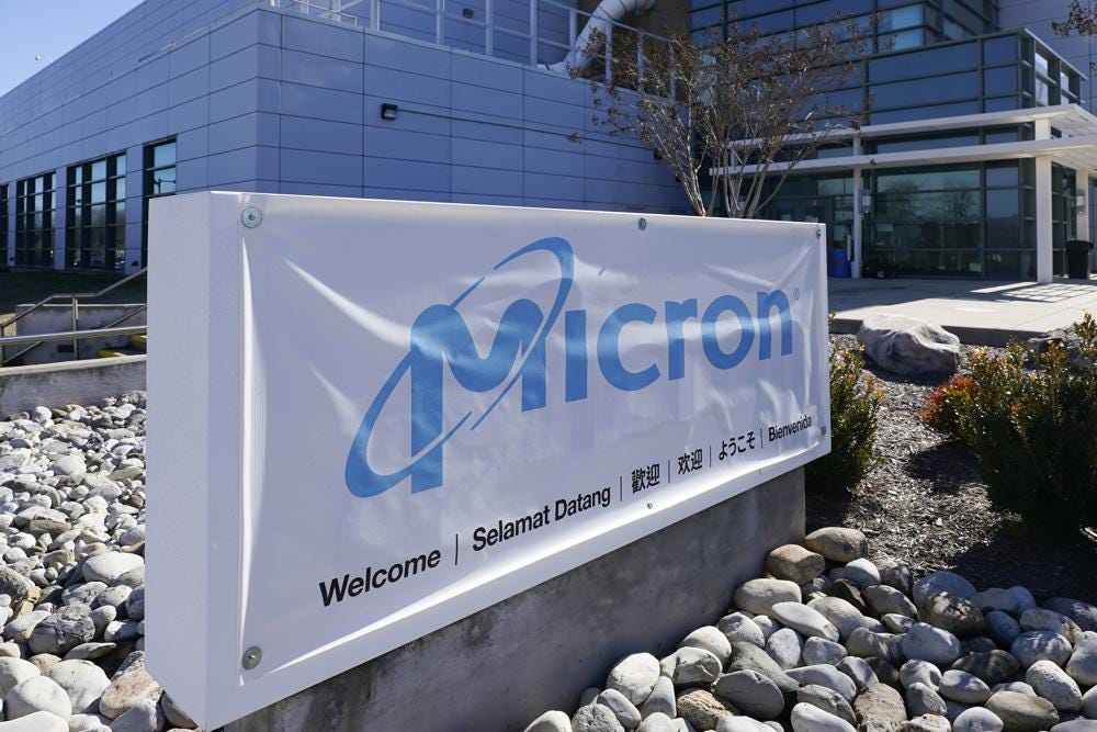 FILE - A sign marks the entrance of the Micron Technology automotive chip manufacturing plant on Feb. 11, 2022, in Manassas, Va. Micron, one of the world’s largest microchip manufacturers, is expected to open a semiconductor plant in New York, promising a $100 billion investment and a plant that could bring 50,000 jobs to the state. Senate Majority Leader Charles Schumer confirmed the company's plan to The Associated Press after speaking to its leaders. (AP Photo/Steve Helber, File) FILE - A sign marks the entrance of the Micron Technology automotive chip manufacturing plant on Feb. 11, 2022, in Manassas, Va. Micron, one of the world’s largest microchip manufacturers, is expected to open a semiconductor plant in New York, promising a $100 billion investment and a plant that could bring 50,000 jobs to the state. Senate Majority Leader Charles Schumer confirmed the company's plan to The Associated Press after speaking to its leaders. (AP Photo/Steve Helber, File)